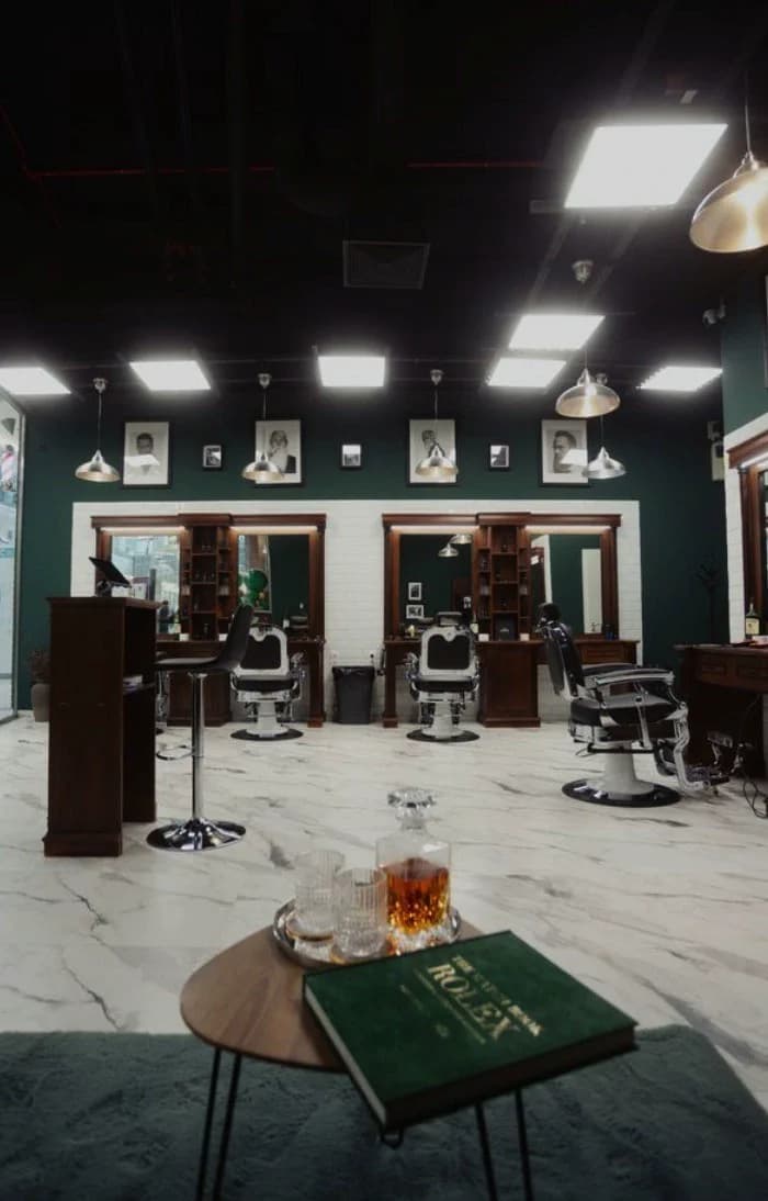 Salon interior with barber chairs and mirrors